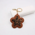 Leopard print flower keychain with brown leather edges and gold metal hardware for bags - Faux Hair Coffee Leopard