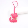 Close-up of rose red leather cat bag charm with fine stitching and golden chain details - Lanyard Cat / Rose Red