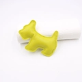 Detailed close-up of a neon yellow leather puppy charm with precise perimeter stitching - Yellow-Green