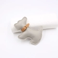 Detail view of a gray leather puppy charm with precise stitching and a brown collar accent - Gray