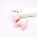 Detailed view of a pink leather Schnauzer keychain with premium golden metal hardware - Light Pink