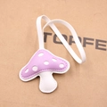 Detailed view of mushroom-shaped leather bag charm with purple polka dots and white strap - Taro Purple