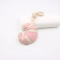 Close-up of beige and pink croissant-shaped leather pendant with detailed stitching - Rice Pink