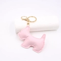 Close-up of pink leather puppy keychain with fine stitching and golden metal hardware - Light Pink