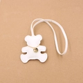 Detailed view of white faux leather bear charm with fine stitching and golden chain - White