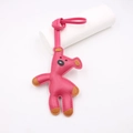 Detail of handmade bright pink leather teddy bear charm with a matching strap - Bean Bear Style / Rose Red