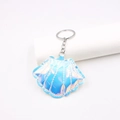 Detail of laser iridescent shell keychain with gradient blue-purple finish and silver ring - Iridescent Blue