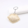 Stereo seashell leather keychain in champagne gold with silver ring and stitch texture - Gold