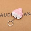Macro detail of strawberry-shaped leather keychain with white polka dots and silver ring - Strawberry Shape / Pink