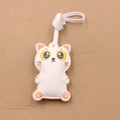 Detail of creative cartoon cat leather bag tag with white strap on rustic background - Cute Cat