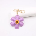 Lila Sonnenblumen Schlüsselanhänger aus Leder mit gelber Gänseblümchenmitte und Goldclip - Sonnenblume Stil / Taro-Lila