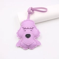 Detail of light purple leather poodle bag charm featuring textured finish and neat stitching - Taro Purple