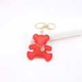 Detail of red leather bear keychain featuring gold chain and lobster clasp - Bear / Red
