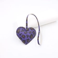 Detailed view of heart-shaped purple leopard print leather bag charm with long strap - Purple
