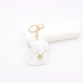 Detail of white leather cat keychain with gold chain collar and engraved pendant - White
