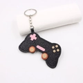Sparkly black glitter game controller keychain with colorful buttons and silver metal ring - Edge-Painted Game Controller (001)