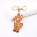 Double-sided embroidered deer leather keychain with gold metal ring on white background - Embroidered Deer