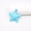 Close-up of light blue star-shaped PU leather pendant with neat stitching details - Star Accessories / Blue