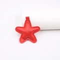 Detail of red faux leather star pendant with refined stitching and textured surface - Star Accessories / Red