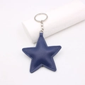 Navy blue star-shaped leather keychain with lychee texture and silver metal ring on white background - Navy Blue