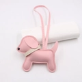Close-up of pink leather puppy bag charm with white collar detail and hand-stitched edges - Pink - Beige Collar