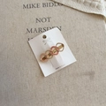 Detail of gold-tone heart hair clip with pink enamel inlay on display card - Pink Square (D-5961-6)