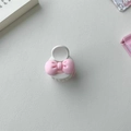 Cute pink and cream bow hair claws for women on white textured background - Pink And White Bow Style (D-5230-1)