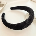 Padded black velvet headband with vintage floral embroidery and a handmade woven label - Black