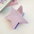 Detailed close-up of a light purple star hair claw clip on a clean white desk setup - Purple