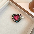 Detail of sweet heart-shaped hair clip with colorful crystals on a textured tray - Colorful Rhinestone Black Heart