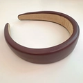 Detail of burgundy PU leather headband with thick design and textured grain finish - Burgundy
