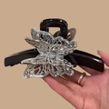 Silver 3D butterfly hair claw clip with black resin base for women's elegant hairstyles - Butterfly Hollow Claw Clip (D-5382-1)