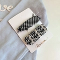 Detail of plaid embroidered hair clips and tweed barrettes on white display card - Black And White Plaid (D-4409-3)
