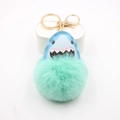 Detail of shark plush ball keychain with golden metal ring and light blue leather shark head - Mint Green