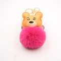 Close-up of cute cartoon tiger faux leather head with a soft magenta plush pom pom keychain - Gold Keychain / Rose Red