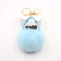 Light blue shark pom-pom keychain with leather shark charm and golden metal ring - Light Blue