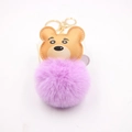Detail of cute bear keychain featuring purple pom pom and golden metal hardware clip - Gold Keychain / Taro Purple