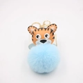 Detail of orange tiger keychain with blue faux fur pompom and golden lobster clasp - Gold Keychain / Blue