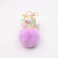 Detailed close-up of pink leather unicorn head with purple faux fur pompom keychain - Taro Purple