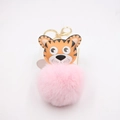 Detail of cartoon tiger head plush keychain with soft pink pompom and golden clasp - Gold Keychain / Pink