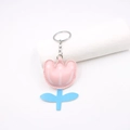 Close-up of pink and blue faux leather tulip keychain with detailed white stitching - Daffodil Keychain / Pink