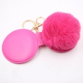 Close-up of fluffy magenta faux fur pompom keychain with gold metal ring and clasp - Rose Red