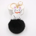 Detail of Maneki Neko charm with black fluffy pom-pom and gold metal keychain hook - Black
