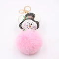 Detail view of pink pompom keychain with snowman charm and golden lobster clasp - Light Pink