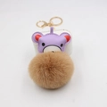 Cute cartoon bear keychain with purple faux leather head and large brown pompom on white - Khaki