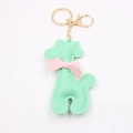 Portachiavi giraffa in pelle verde menta con fiocco rosa e moschettone in metallo oro - Verde