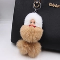Cute sleeping doll keychain with white faux fur and brown fluffy pom pom on handbag - Sleeping Doll / Khaki