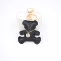Cartoon black leather bear keychain with golden metal ring and premium white stitching - Black