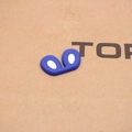 Vista macro dettagliata degli accessori in silicone blu per giocattoli fai-da-te - Blu Reale