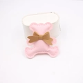 Detailed close-up of a pink leather teddy bear charm with brown bow for DIY accessories - Light Pink